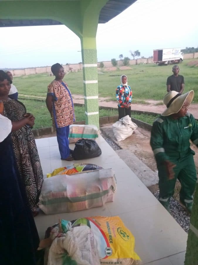Bags of rice and food supplies set out on the veranda for beneficiaries to collect